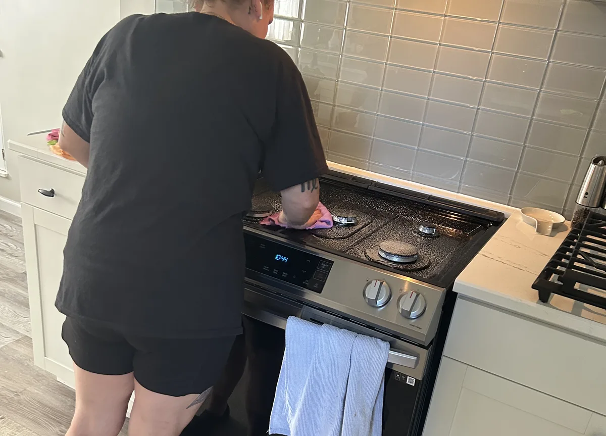 House cleaning in Avon Lake, OH — cleaner detailing a kitchen