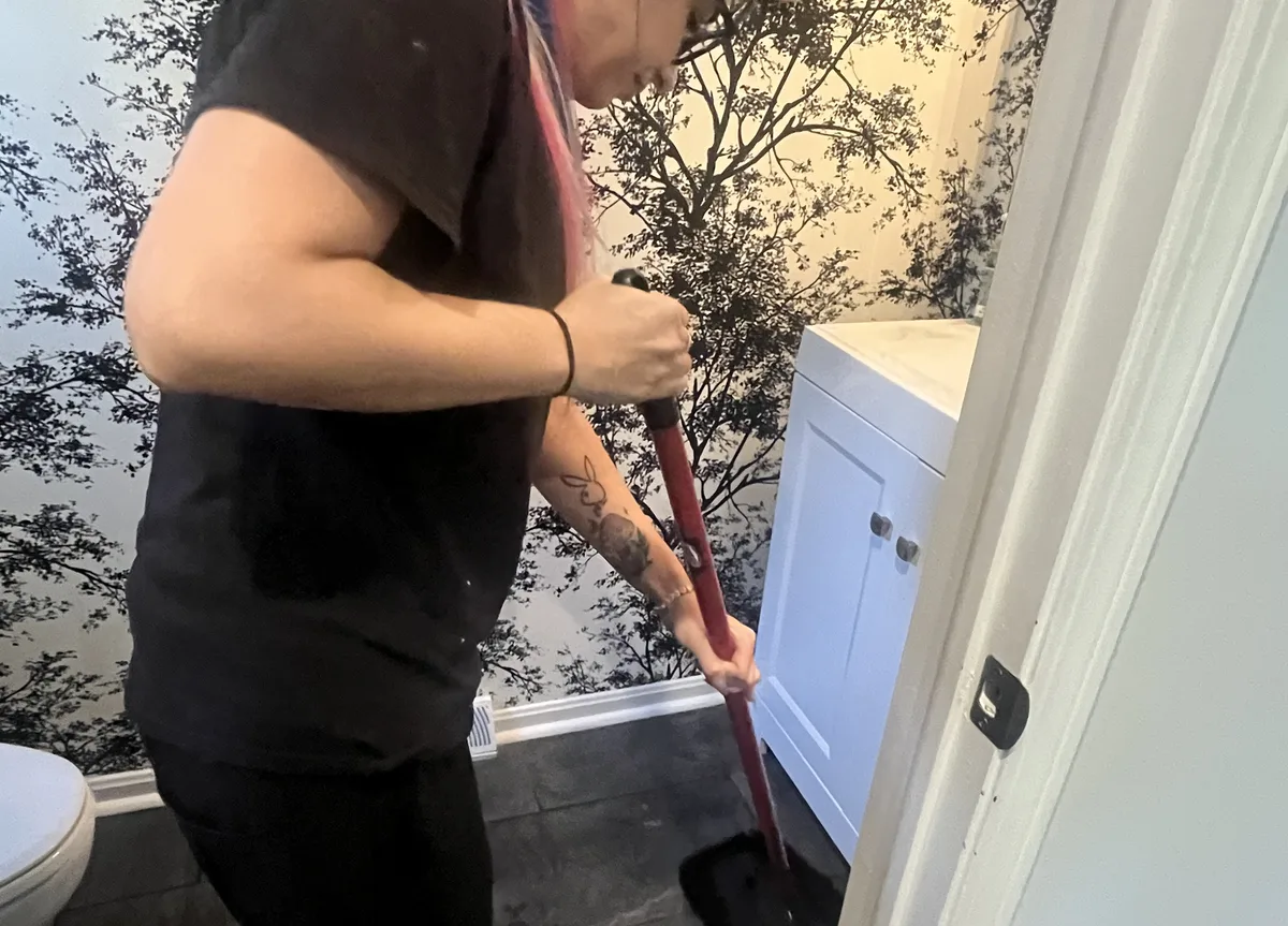 House cleaning in Avon, OH — cleaner wiping down a bathroom