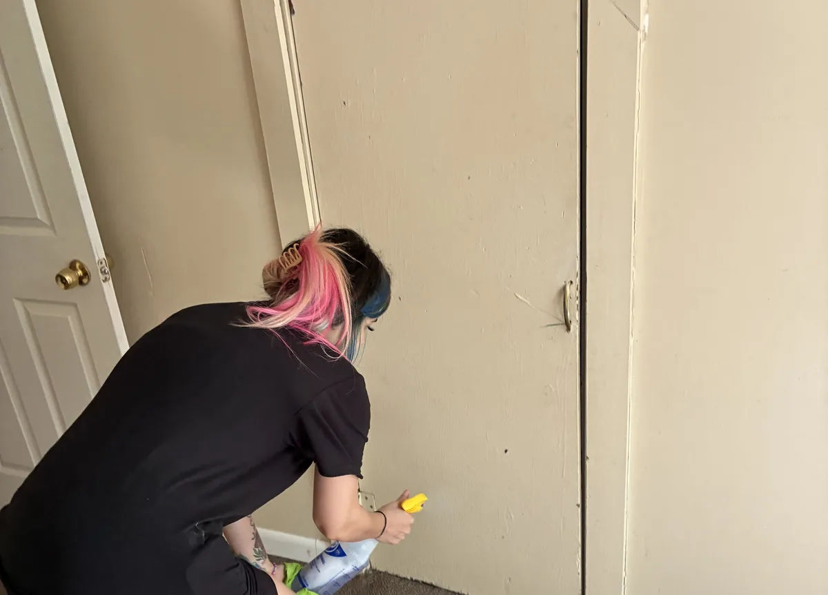 Move in/out cleaning service — cleaner detailing an empty home closet